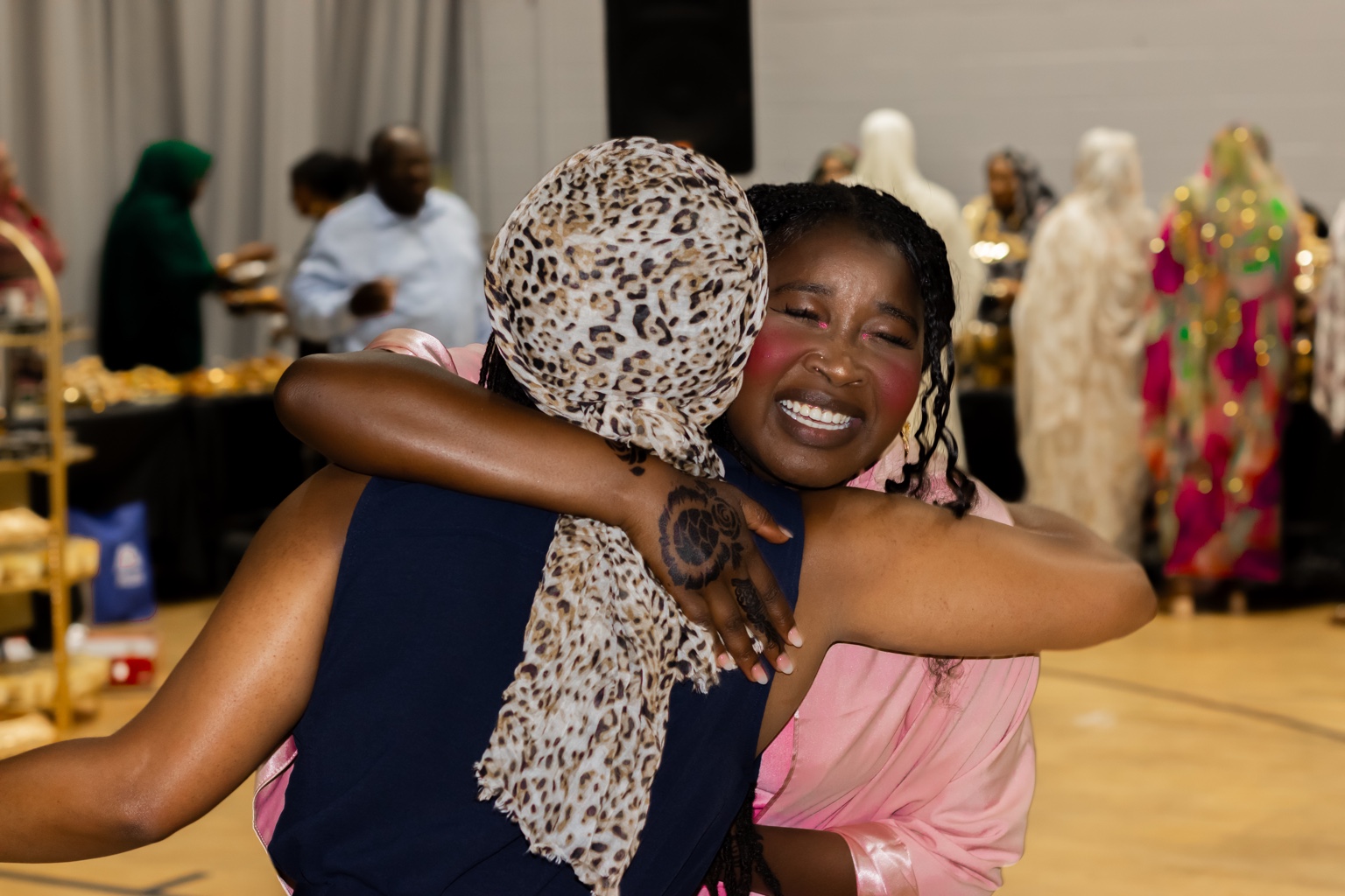Emotional candid hug photographed at an event