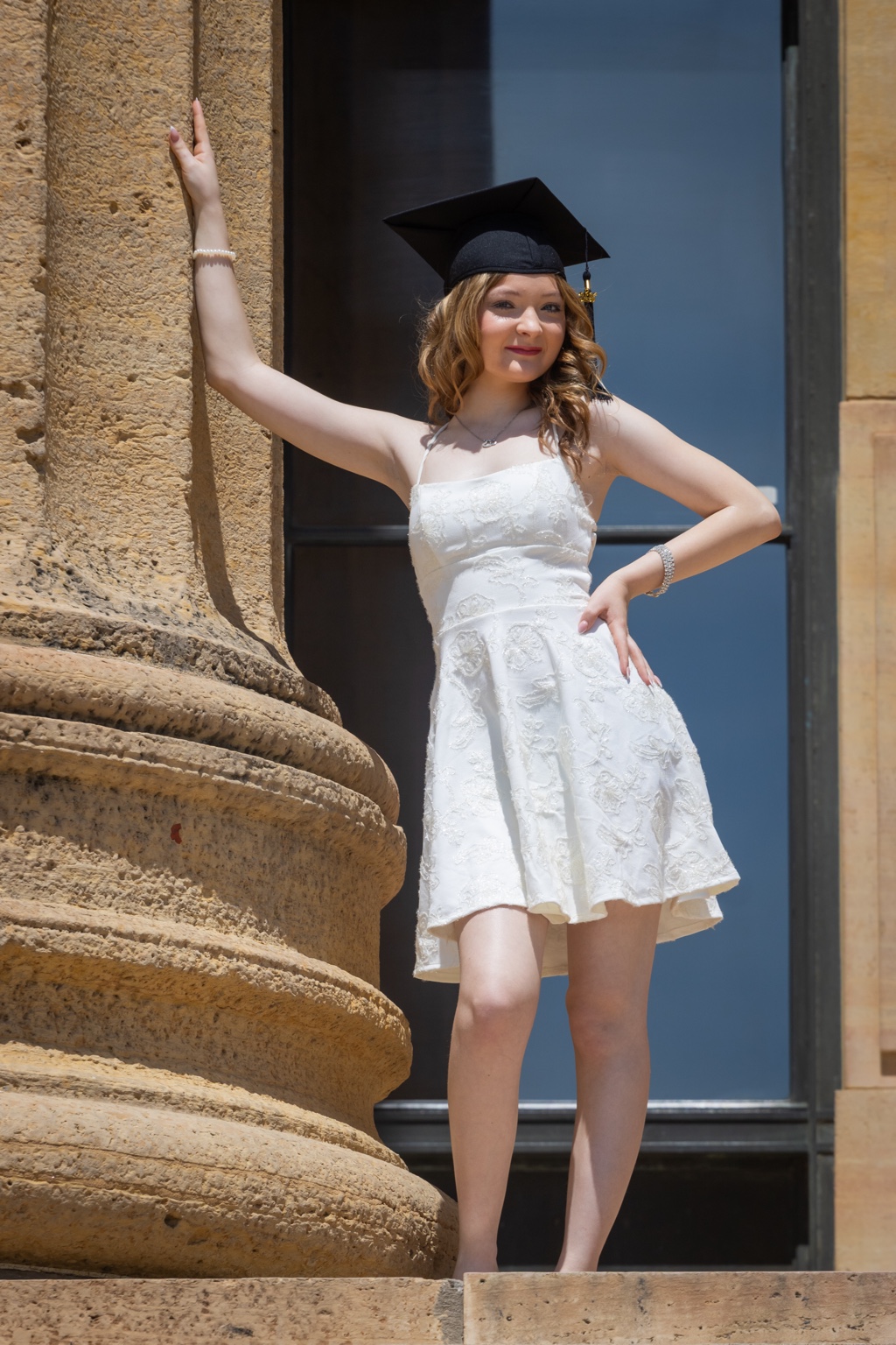 Graduation portrait beside historic architecture