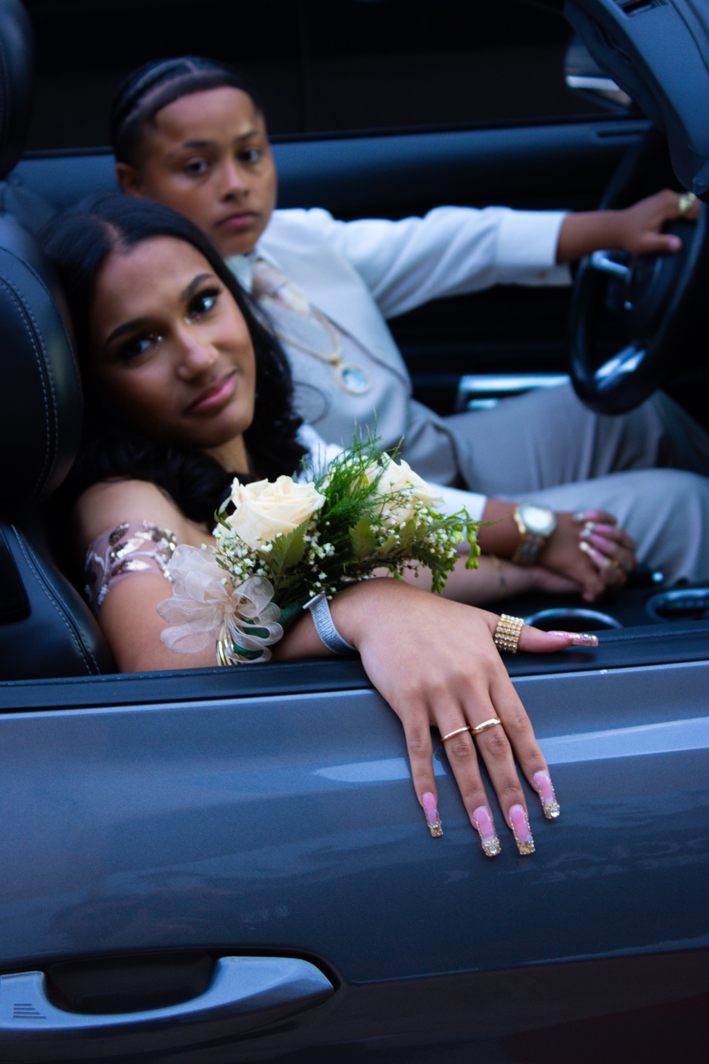 Prom couple portrait inside a car