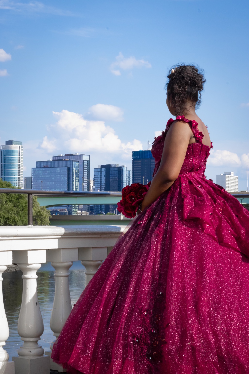 Quinceañera portrait overlooking the city